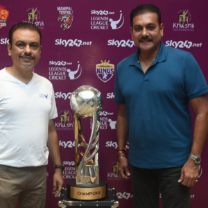 Caption: Legends League Cricket Co-founder & CEO Raman Raheja and Legends League Cricket Commissioner Ravi Shastri pose with the League trophy in Kolkata on Friday